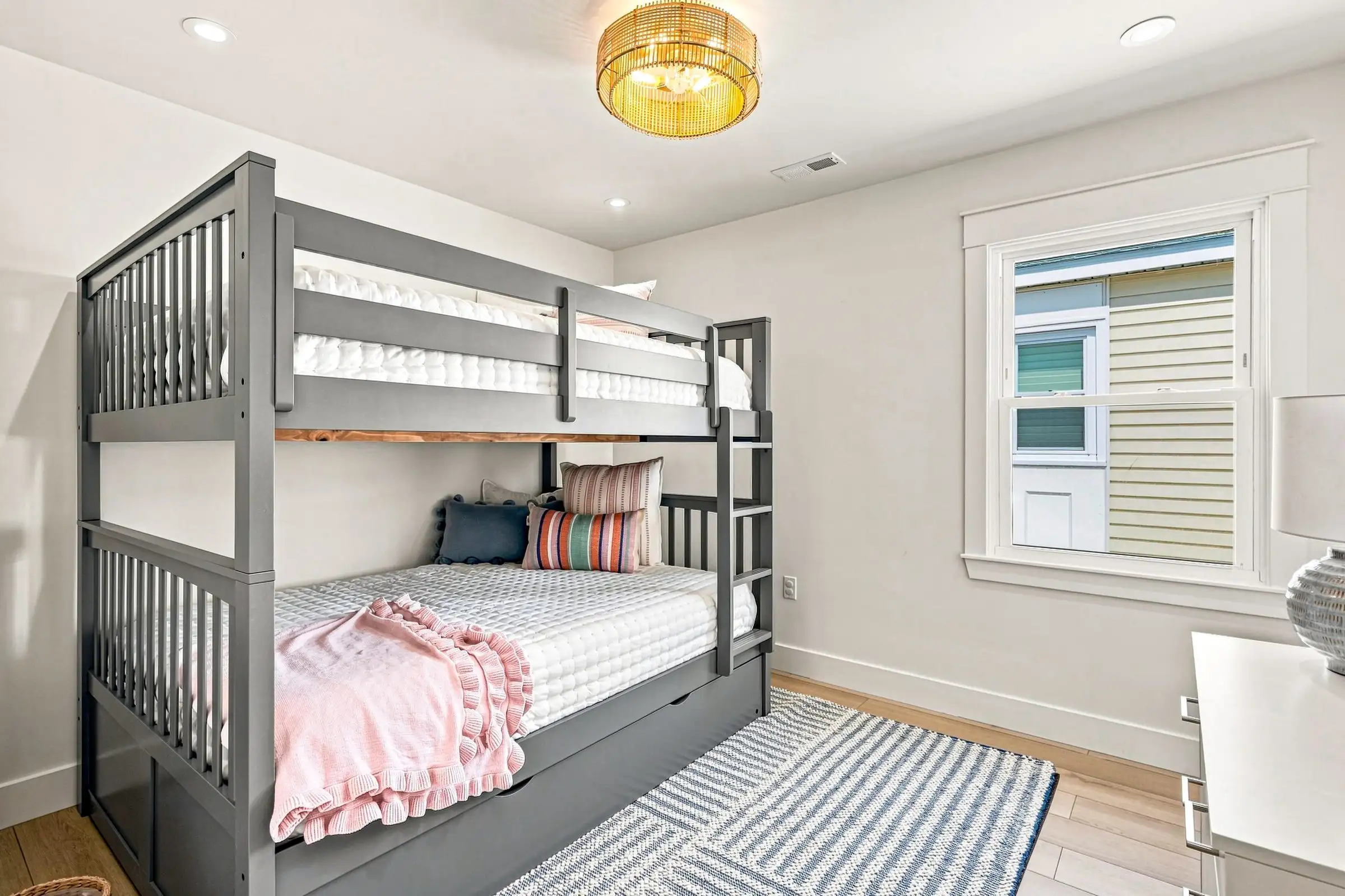 Bunk room with a full-over-full bunk bed and pull-out trundle