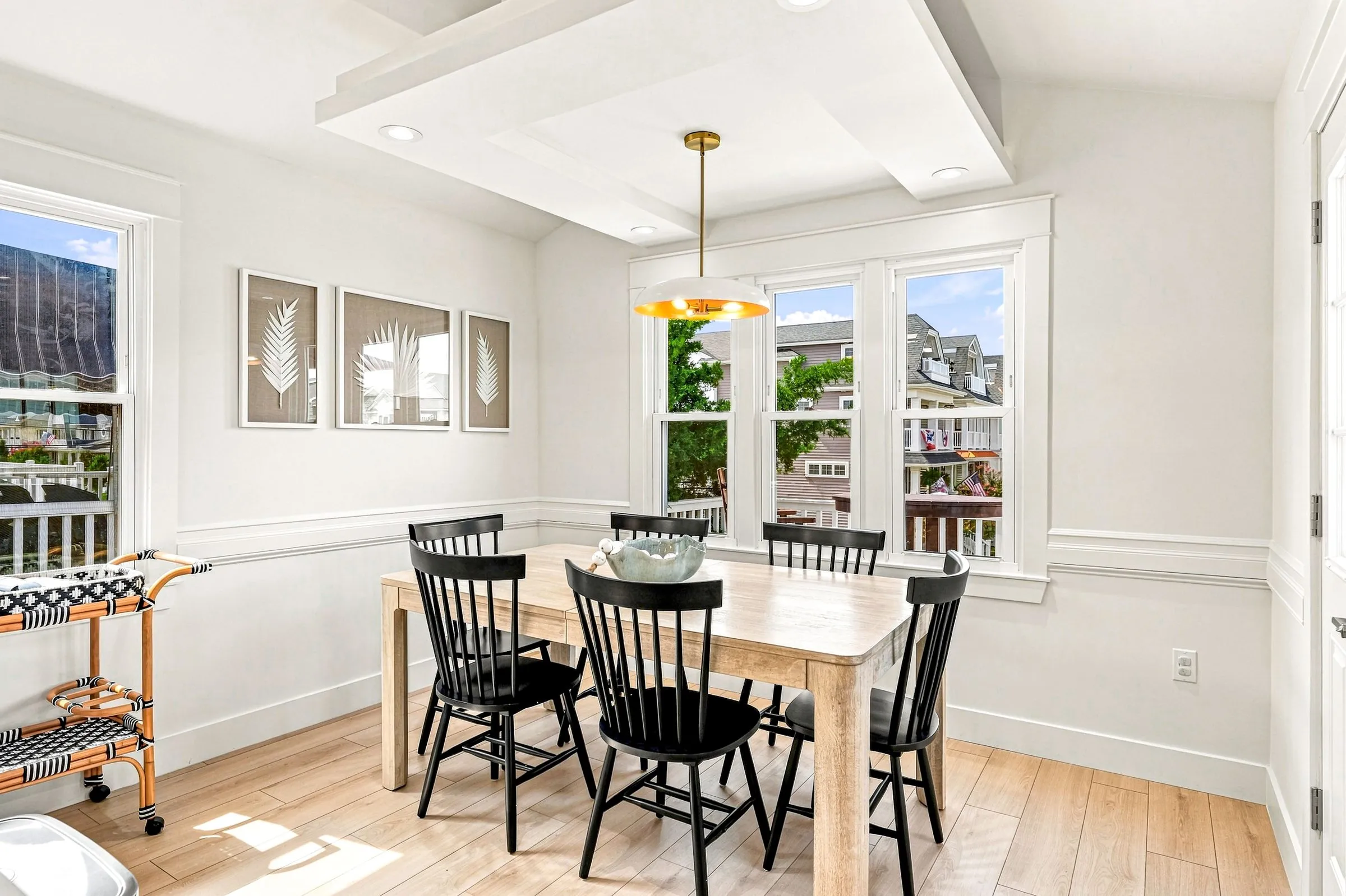 Dining room with a table for six beside the windows