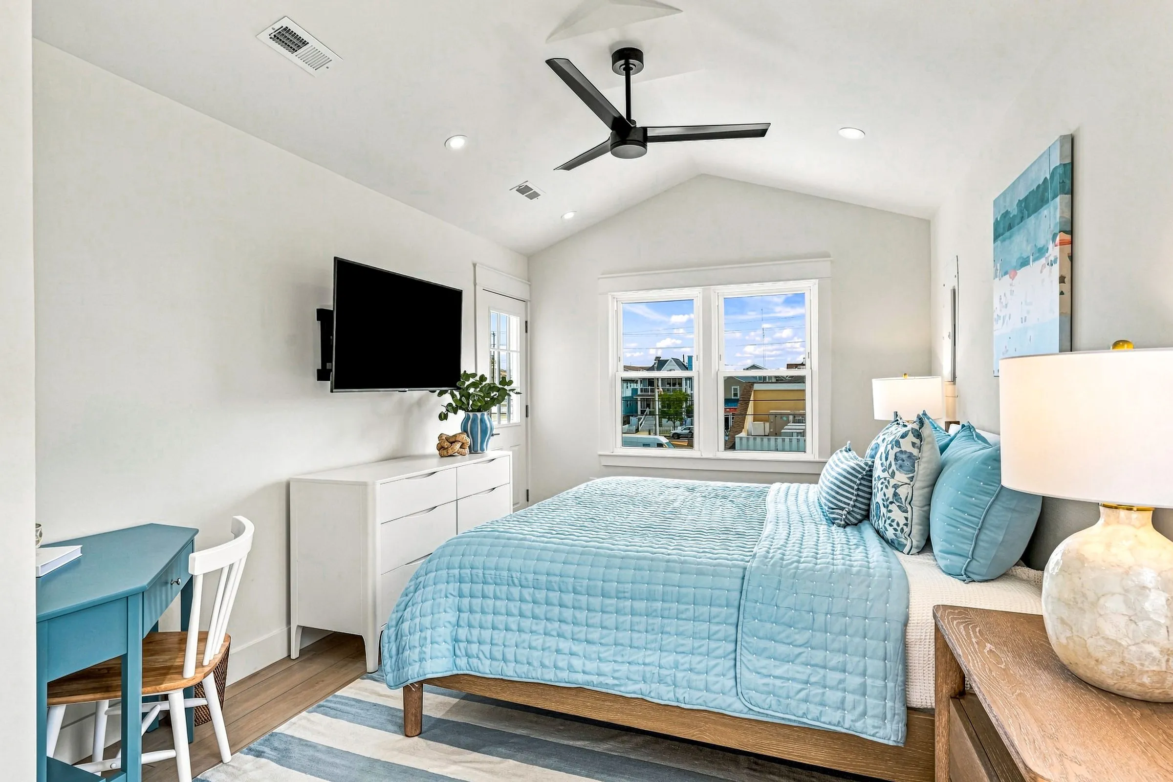 Primary bedroom with a small desk nook by the window