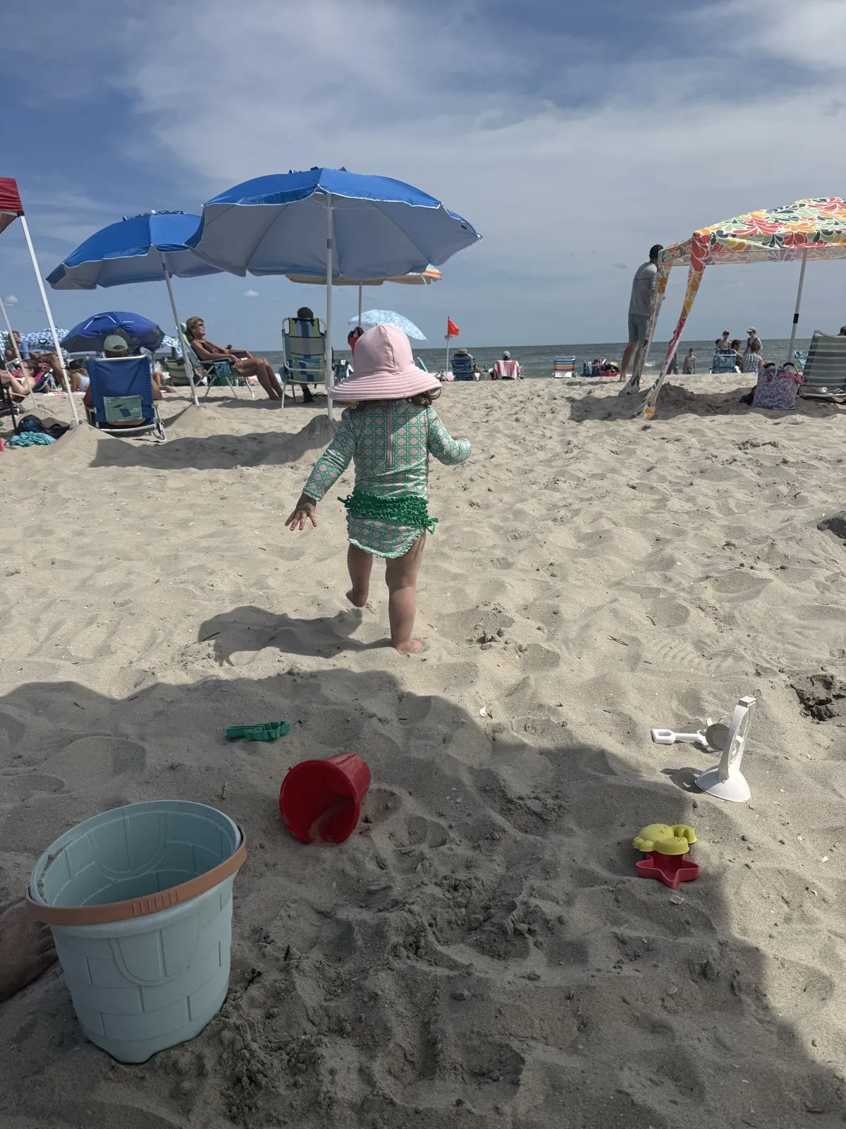 Our daughter on 12th Street Beach with a bucket and shovel